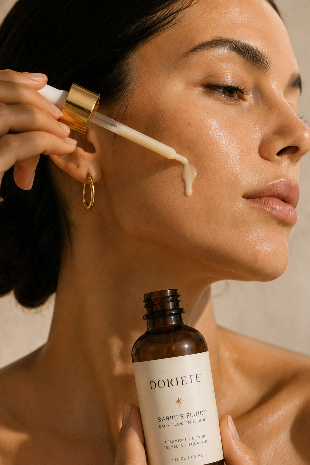 Woman holding DORIETE bottle with serum dropper to face